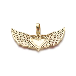 Macro detail of gold winged heart pendant with colorful micro-pave cubic zirconia crystals