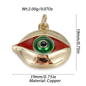 Macro detail of copper Evil Eye pendant with red enamel and gold plating finish