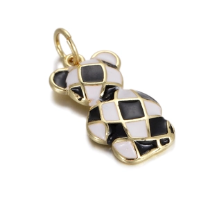 Detailed macro view of baroque bear pendant with black and white checkerboard enamel