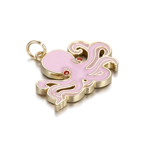 Macro detail of a pink enamel octopus pendant charm with gold-plated metal finish