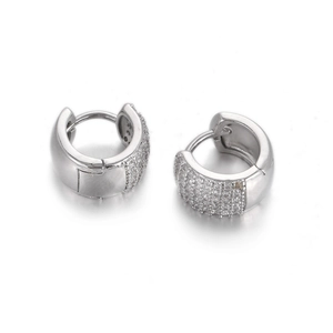 Detailed close-up of silver hoop earrings with pavé set white zircon and secure clasp
