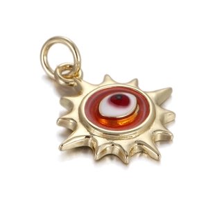 Detailed close-up of golden sun pendant with evil eye center and high polish finish