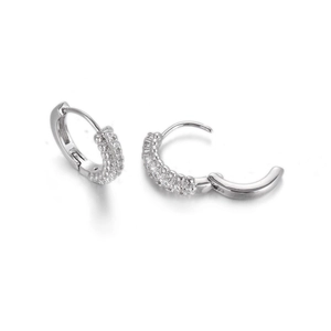 Detail of silver hoop earrings with triple row micro-paved cubic zirconia stones