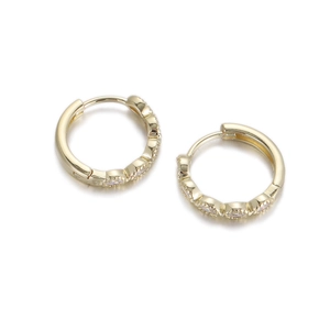 Close-up of gold-plated hoop earrings with cubic zirconia and olive-shaped settings