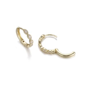 Detail of gold hoop earrings with zircon marquise stones showing the secure snap closure