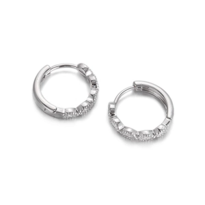 Detailed close-up of silver hoop earrings with pave-set cubic zirconia stones