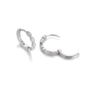 Silver huggie earrings with marquise cubic zirconia showing open and closed clasp detail