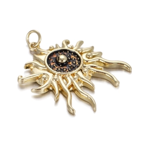 Detail of golden sun-shaped pendant with textured dark enamel center for DIY jewelry