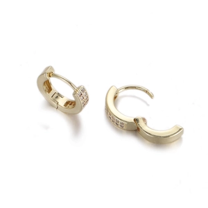 Macro detail of gold hoop earrings featuring triple-row micro-pave white zircon stones
