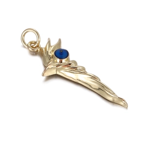 Detailed view of a golden evil eye dagger charm featuring a vibrant blue glass bead inlay