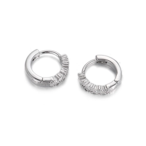 Detail of silver hoop earrings featuring micro-set sparkling zircon stones on white background