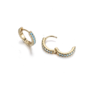 Detailed view of gold hoop earrings featuring elegant light blue beads on white background