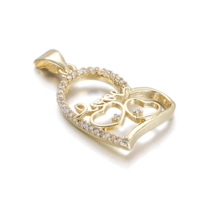 Close-up of a 14k gold-plated heart pendant with zircon accents and Love lettering