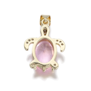 Detailed view of turtle pendant with pink oval zircon and 14k gold plated micro-inlay