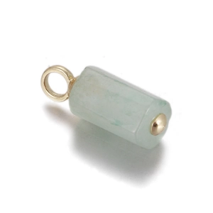 Macro detail of a light green natural stone cylinder pendant with gold metallic finishes