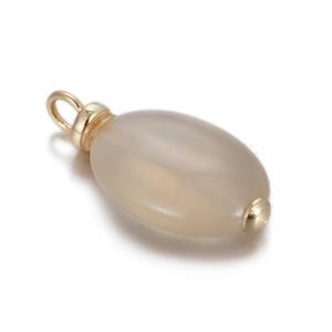 Macro shot of oval grey gemstone pendant with gold metal clasp for DIY necklace