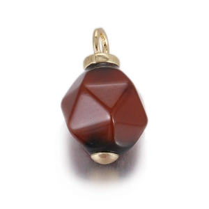 Close-up of faceted reddish-brown stone pendant with gold hardware for DIY jewelry