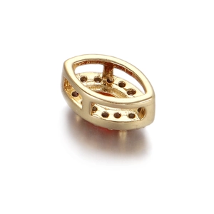 Macro shot of 14k gold-plated marquise charm with pre-drilled holes for DIY jewelry