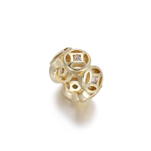Detailed view of 14k gold-plated coin spacer bead with sparkling zircon for jewelry DIY