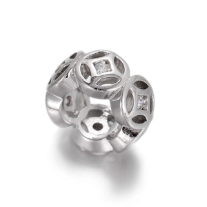 Macro shot of 14k gold plated flower coin spacer bead with cubic zirconia for DIY jewelry