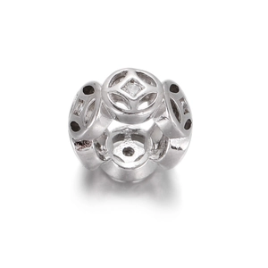 Macro view of 14k gold-filled flower coin charm with cubic zirconia for jewelry making