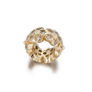Macro shot of 14k gold-filled flower bead connector with sparkling pavé zircons