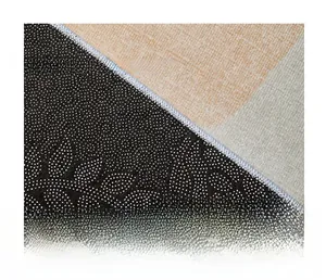Detail of non-slip backing with plastic dots on the sport style soccer area rug