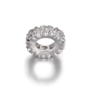 Detailed macro view of 14k gold plated flower bead with micro-pave white zircon stones