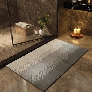 Minimalist diatom mud bath mat with grey wave texture on marble bathroom floor