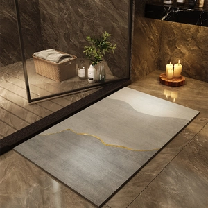 Detail of diatom mud bath mat with abstract mountain pattern and golden line