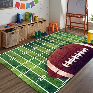 Detailed view of football field carpet with yardage lines and a large rugby ball print