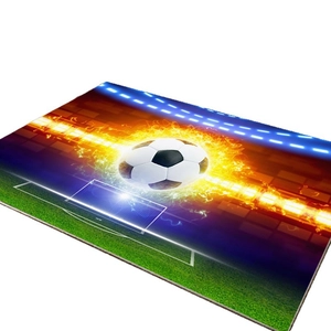 Modern rectangle area rug with burning soccer ball design on a green field backdrop