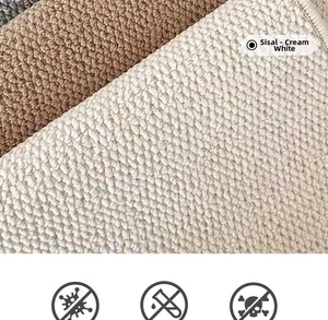 Detail of durable sisal rug showing dense pineapple weave texture in milky white and brown