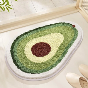Détail du tapis avocat en faux cachemire doux avec dégradé de vert et bordure blanche chic