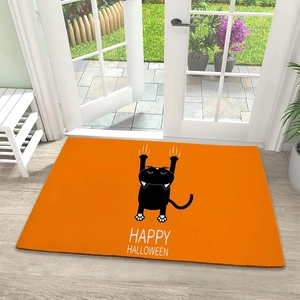 Close-up of Halloween door mat featuring a black cat design and Happy Halloween text