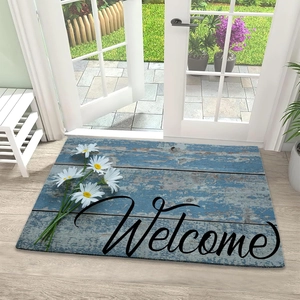 Welcome mat with blue wood texture and white daisies on indoor wooden flooring