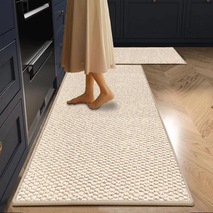 Beige sisal-style kitchen mat set with textured weave and non-slip backing on wood floor