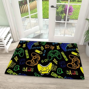 Macro view of gaming door mat featuring neon controller patterns on black fabric
