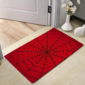 Detail of red diatom mud door mat with black spider web pattern for home entryway