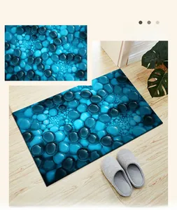 Detail of 3D blue stone pattern door mat with soft non-slip surface on wood floor