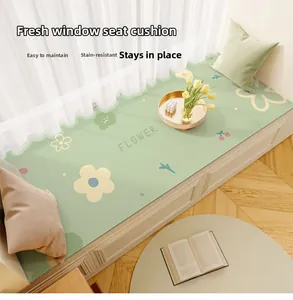 Close-up of waterproof leather bay window mat with green floral patterns and scalloped edges