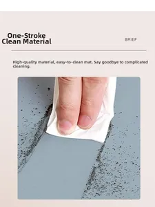 Close-up of gray waterproof leather balcony mat being wiped clean with a tissue