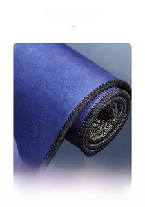Detail of blue kitchen mat showing double-stitched edges and non-slip bottom texture