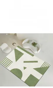 Detail view of modern green geometric carpet with minimalist patterns in a cozy living room