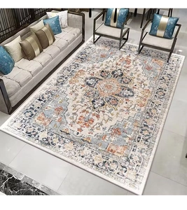 Close-up of bohemian Persian rug with intricate medallion patterns in beige and blue