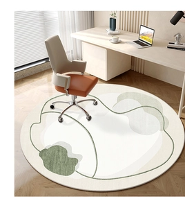 Detail of round rug with abstract green and cream organic patterns in a home office
