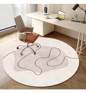 Detailed texture of round minimalist carpet with abstract patterns under a modern office chair