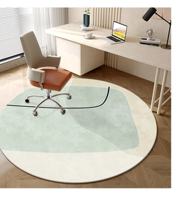 Detail view of round sage green geometric rug under office chair in modern study
