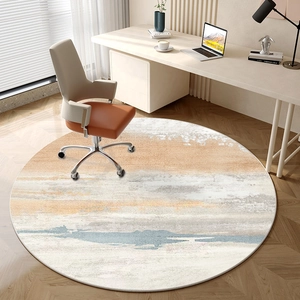 Modern abstract round area rug in orange and gray for living room or home office