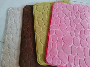 Close-up of embossed pebble texture on coral fleece non-slip bathroom floor mats